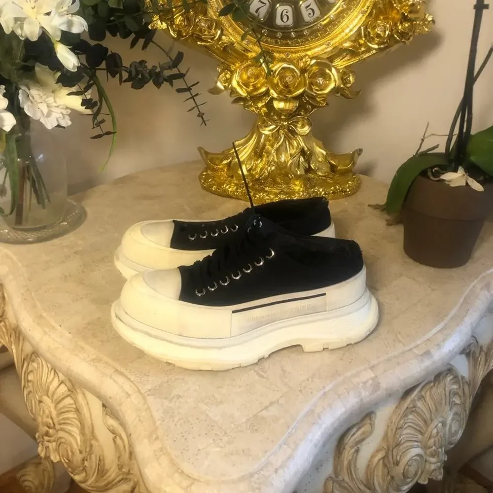 Alexander McQueen black and white platform chucks.